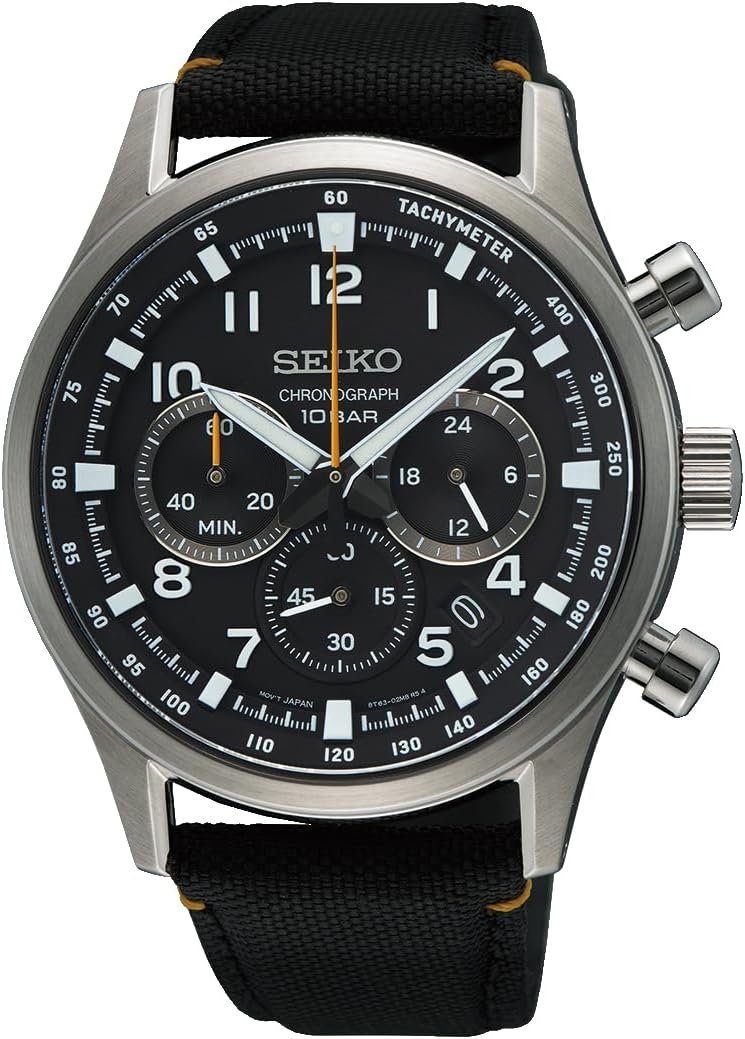 Seiko chronograph wristwatch with black dial, white numerals, three subdials, and tachymeter bezel on a black fabric strap.